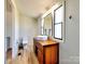 Stylish bathroom features a modern vanity and sink with wood look flooring and neutral wall paint at 1038 Gold Mine Dr, Catawba, NC 28609