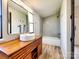 The updated bathroom features a wood vanity, basin sink, and bathtub at 1038 Gold Mine Dr, Catawba, NC 28609