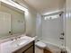 Modern bathroom with white subway tiles, tub, and an updated sink with lots of natural light at 1038 Gold Mine Dr, Catawba, NC 28609