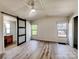 A large bedroom features a sliding barn door and two large windows at 1038 Gold Mine Dr, Catawba, NC 28609