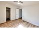 Neutral bedroom with wood-look floors, ceiling fan, open doors and neutral paint throughout the house at 1038 Gold Mine Dr, Catawba, NC 28609