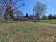Single story home with front porch, surrounded by trees and a spacious yard at 1038 Gold Mine Dr, Catawba, NC 28609