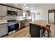 Kitchen with stainless appliances and breakfast bar seating at 1038 Gold Mine Dr, Catawba, NC 28609