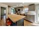 Modern kitchen with stainless appliances, gray cabinets and butcher block island at 1038 Gold Mine Dr, Catawba, NC 28609