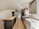 A bright kitchen features stainless appliances, gray cabinets, and a butcher block island at 1038 Gold Mine Dr, Catawba, NC 28609