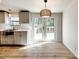 A sunny kitchen features gray cabinets and French doors leading to the deck at 1038 Gold Mine Dr, Catawba, NC 28609