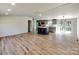 Open living space featuring an island, wood flooring, and neutral paint at 1038 Gold Mine Dr, Catawba, NC 28609