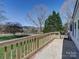 Side porch with wooden railing and view of the yard at 1038 Gold Mine Dr, Catawba, NC 28609