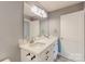 Bathroom featuring double sinks, modern lighting, and updated vanity at 108 Devynne Ct, Salisbury, NC 28146