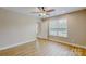 Bedroom features a ceiling fan, natural light and wood-look laminate floors at 108 Devynne Ct, Salisbury, NC 28146