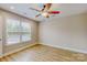Bedroom featuring a ceiling fan, and a large window for ample natural light at 108 Devynne Ct, Salisbury, NC 28146