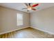 Bedroom featuring a ceiling fan, natural light and wood-look laminate floors at 108 Devynne Ct, Salisbury, NC 28146
