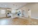 Modern kitchen featuring white cabinets, stainless steel appliances, and a stylish island with pendant lighting at 108 Devynne Ct, Salisbury, NC 28146