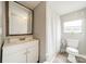 Compact bathroom with a white vanity, toilet, and shower, designed for efficient use of space at 110 Crescent Heights Dr, Salisbury, NC 28146