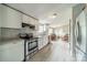 Modern kitchen with white cabinets, stainless steel appliances, and a stylish backsplash, perfect for culinary enthusiasts at 110 Crescent Heights Dr, Salisbury, NC 28146