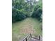 A large, sloping backyard offers ample space for outdoor activities and gardening at 114 Wayne Ave, Kannapolis, NC 28081