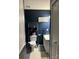 Cozy bathroom with a toilet, sink, wall decor, and patterned floor mat at 114 Wayne Ave, Kannapolis, NC 28081