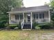 Charming single-story home with a covered porch and well-maintained landscaping at 114 Wayne Ave, Kannapolis, NC 28081