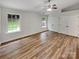 Bedroom with hardwood floors, a ceiling fan, vaulted ceilings, and ample closet space at 12307 Poplar Forest Dr, Charlotte, NC 28278