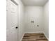 This Laundry Room has wood floors and new white paint at 12307 Poplar Forest Dr, Charlotte, NC 28278