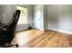 Bedroom featuring hardwood floors, neutral color palette, and a white door and trim at 125 Todd Nw Dr, Concord, NC 28025