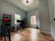 Cozy bedroom featuring hardwood floors, a neutral color palette, and natural lighting at 125 Todd Nw Dr, Concord, NC 28025