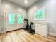 Bonus room featuring French doors, a Peloton bike, and a freezer at 125 Todd Nw Dr, Concord, NC 28025