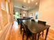 Dining room featuring hardwood floors, natural light, an adjacent living room, and modern fixtures at 125 Todd Nw Dr, Concord, NC 28025