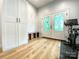 Mud room featuring storage cabinets, a bench with coat hooks, and French doors at 125 Todd Nw Dr, Concord, NC 28025