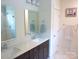 Bathroom features double sinks, white countertops, dark cabinetry and tile shower at 1311 Stonecroft Nw Ln, Concord, NC 28027