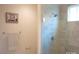 Bathroom showcasing a tile shower with glass enclosure, and light-colored walls at 1311 Stonecroft Nw Ln, Concord, NC 28027