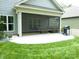 Charming outdoor patio with an open living space overlooking the lush backyard at 1311 Stonecroft Nw Ln, Concord, NC 28027