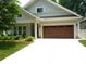 Charming one-story home featuring a two-car garage and beautifully landscaped front yard at 1311 Stonecroft Nw Ln, Concord, NC 28027