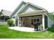 Well-maintained home featuring a covered patio area for relaxing and outdoor living at 1311 Stonecroft Nw Ln, Concord, NC 28027