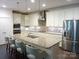 Modern kitchen with stainless steel appliances, granite countertops, and a large island at 1311 Stonecroft Nw Ln, Concord, NC 28027