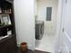 Tile laundry room features modern washer and dryer at 1311 Stonecroft Nw Ln, Concord, NC 28027