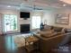 Inviting living room with a fireplace, large windows, and comfortable seating at 1311 Stonecroft Nw Ln, Concord, NC 28027