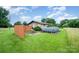 Expansive backyard featuring a patio, garden area, above-ground pool, and perimeter privacy fence at 1410 Patterson St, China Grove, NC 28023