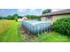 Backyard with above ground pool, shed, and grassy area at 1410 Patterson St, China Grove, NC 28023