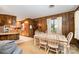 Dining area with wood accents and views into the kitchen, creating a cozy atmosphere at 1410 Patterson St, China Grove, NC 28023