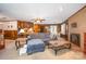 Spacious living room with wood paneling, a fireplace, and an open layout to the dining area at 1410 Patterson St, China Grove, NC 28023