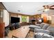 Cozy living room with wood-paneled walls, a comfortable sofa, and entertainment setup at 1410 Patterson St, China Grove, NC 28023