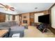 Comfortable living room with a fireplace, wood-paneled walls, and a spacious seating area at 1410 Patterson St, China Grove, NC 28023