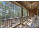 Relax on this balcony with columns, wood ceiling, and outdoor lounge area, offering great views at 14652 Villalonga Ln, Charlotte, NC 28277