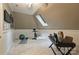 Bonus room with a skylight, exercise bike, and desk at 14652 Villalonga Ln, Charlotte, NC 28277