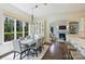 Dining area with a large window looking out into the trees and view to the living room at 14652 Villalonga Ln, Charlotte, NC 28277