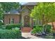 Charming brick home featuring a welcoming front entrance and landscaped with verdant bushes and vibrant hydrangea at 14652 Villalonga Ln, Charlotte, NC 28277
