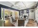 Spacious living room showcases a coffered ceiling, fireplace, built-ins, and hardwood floors at 14652 Villalonga Ln, Charlotte, NC 28277