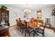 Elegant dining room with striped walls, a chandelier, and seating for eight, perfect for hosting gatherings at 1518 Appaloosa Way, Gastonia, NC 28056