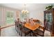 Elegant dining room with striped walls, a chandelier, and seating for eight, perfect for hosting gatherings at 1518 Appaloosa Way, Gastonia, NC 28056